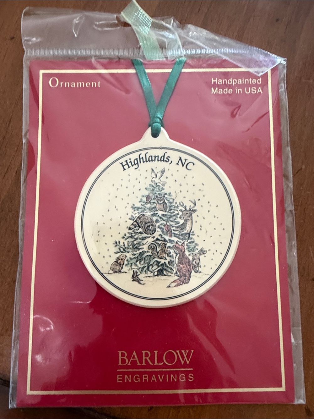 Highlands NC Handpainted Ornament - Cream with Green Ribbon